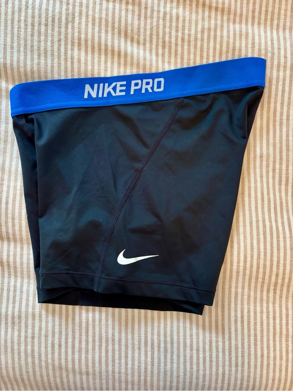 Nike Men's Black Swim Briefs with Blue Waistband and White Swoosh